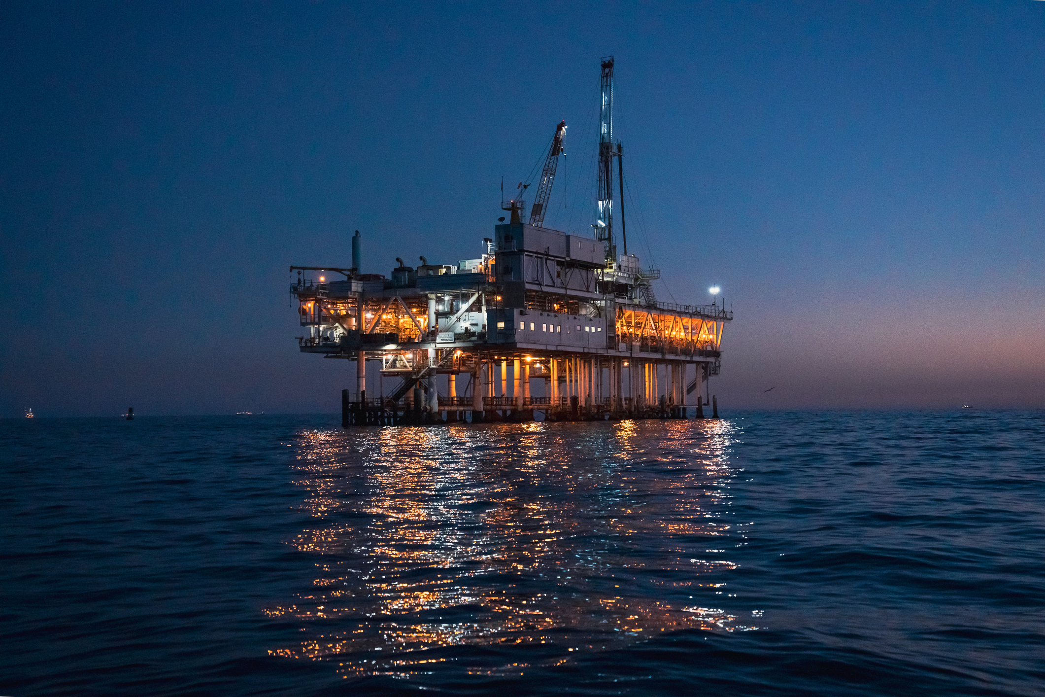 Offshore oil rig at night time