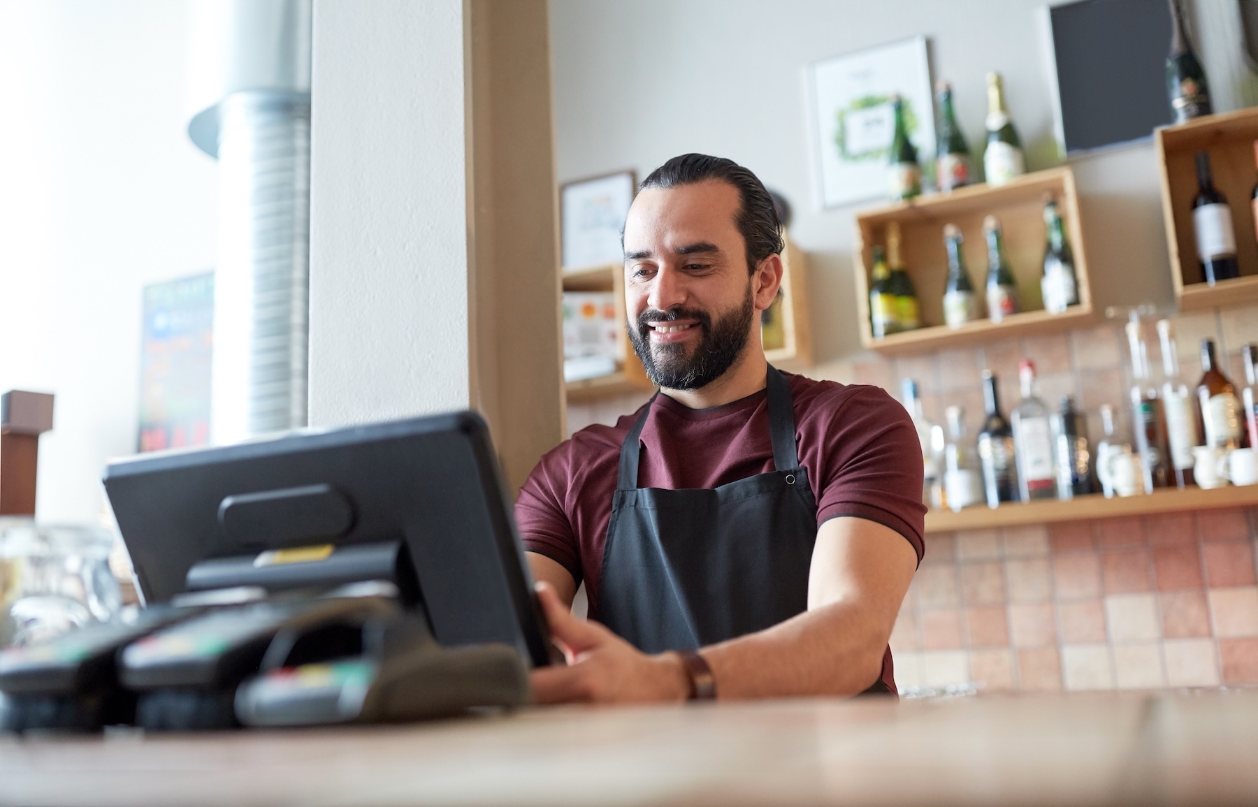 Man working the counter at a small business